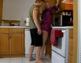 Mommy needs some help in the kitchen from her son-in-law