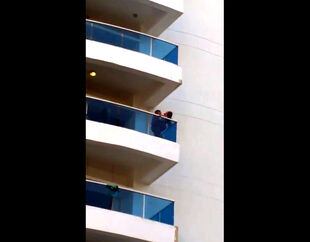 Spycam of duo on balcony