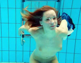 Porno shooting underwater. Bare Teenage peels off off her
